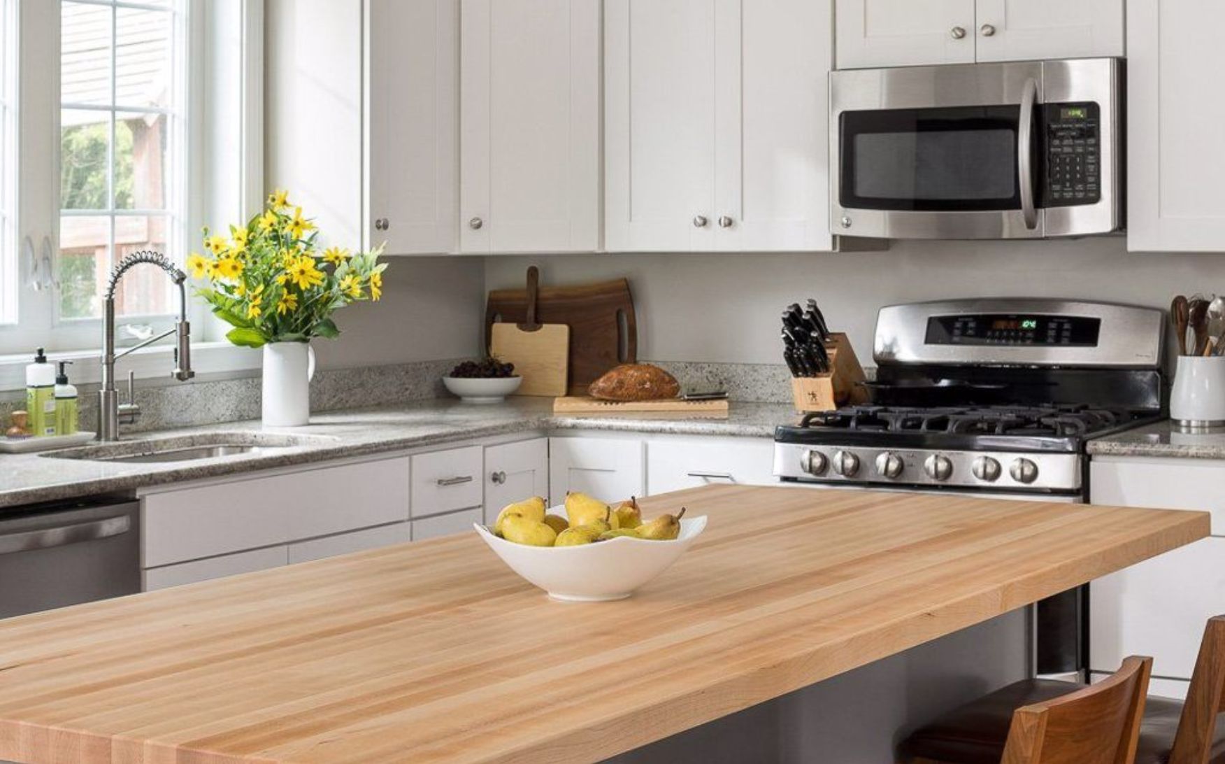 Butcher block Countertops with Champagne Maple Shaker Cabinets