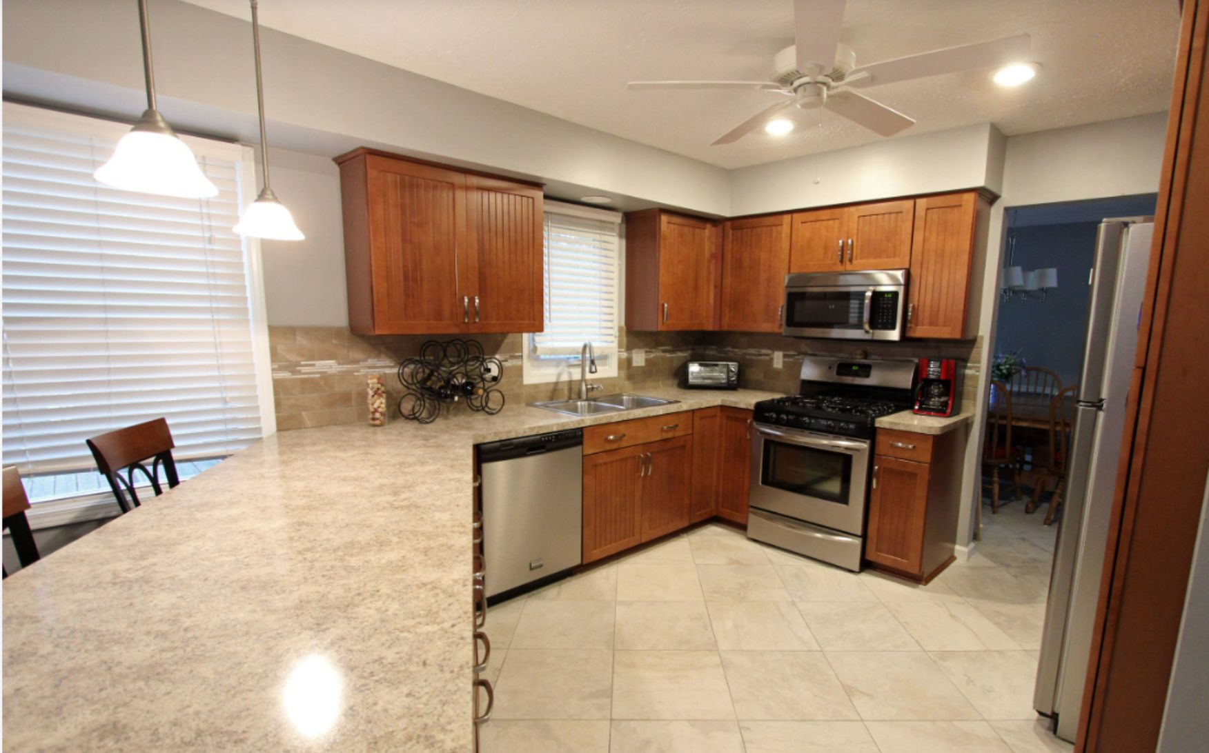Laminate Countertops with Champagne Maple Shaker Cabinets